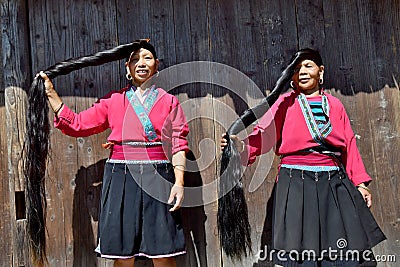 LONGSHENG PING AN, GUANGXI AUTONOMOUS REGION, CHINA â€“ CIRCA JUNE 2016: Portrait of the long hair women from ethnic minority Yao Editorial Stock Photo